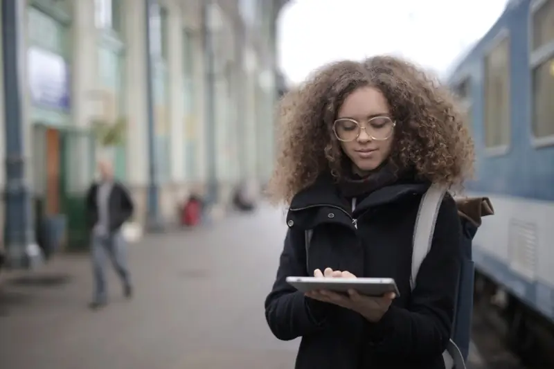 Traveller preparing offline iPad games before a train journey