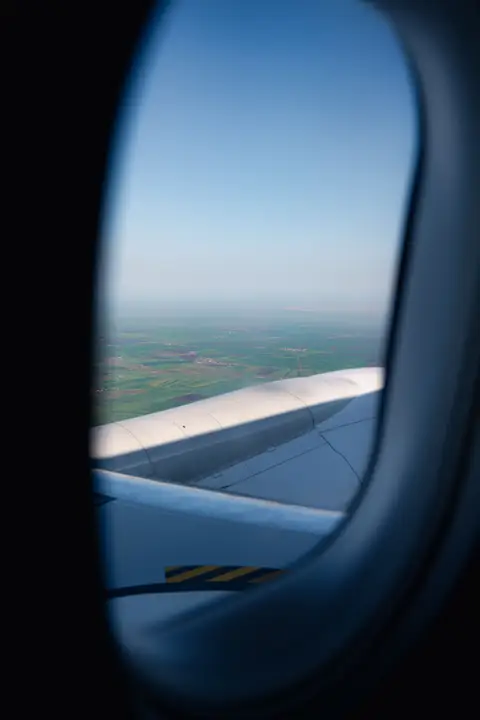Airplane window view for a guide to the best offline games for long flights